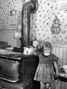 Innocence Amidst Turmoil: A Little Girl In A Dirty Kitchen Of A City Pressed Down By The Weight Of War