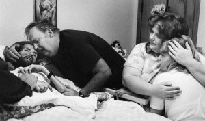 The Heart-Tearing Story Behind The Photo: Father Comforts Son On Deathbed