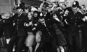 What Really Happened In 1965? The Iconic Photo Of Police VS. The Excited Crowd